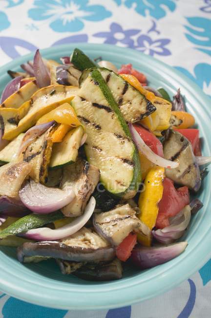 Grilled vegetables on blue plate — Stock Photo