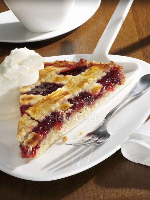 Linzer torte with whipped cream — Stock Photo