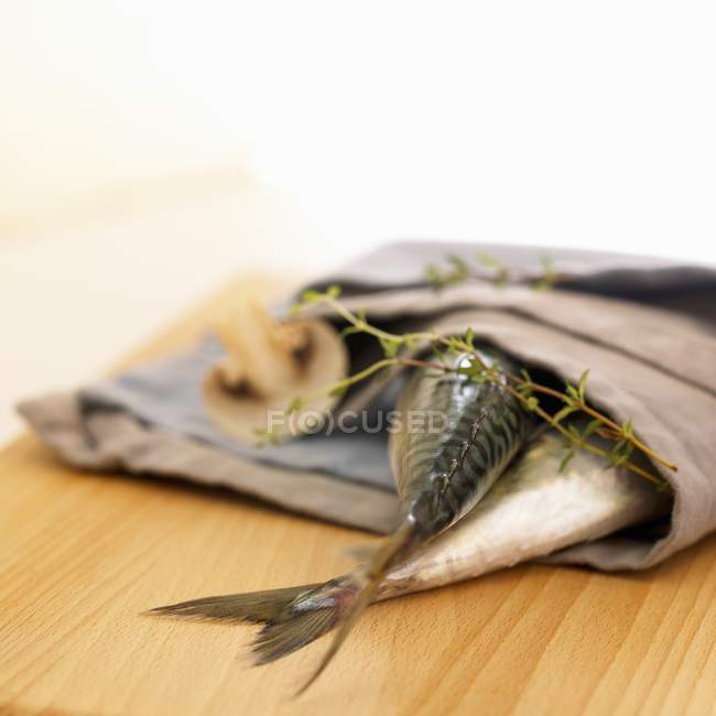 Mackerel tails in fabric napkin — Stock Photo