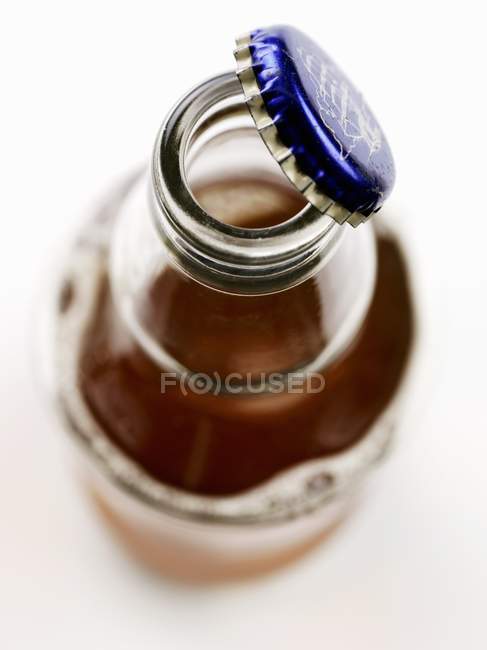Opened bottle of ale — Stock Photo