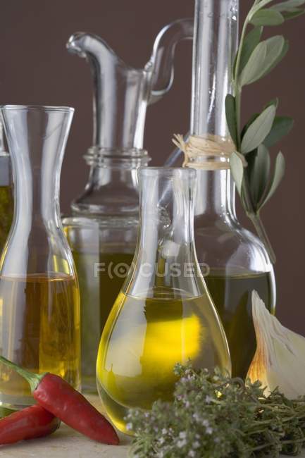 Various types of oil in carafes — Stock Photo
