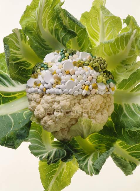 Cauliflower, half consisting of pills — Stock Photo
