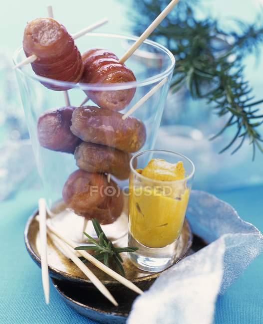 Roasted Bacon-wrapped sausages — Stock Photo
