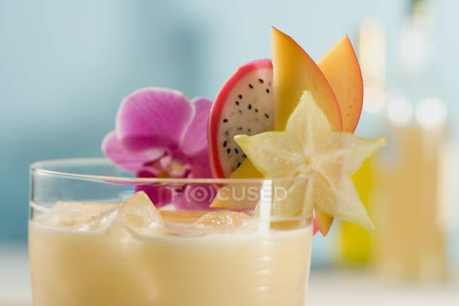 Closeup view of mango Lassi with fresh fruit — Stock Photo