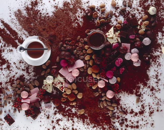 Chocolates and cocoa powder — Stock Photo