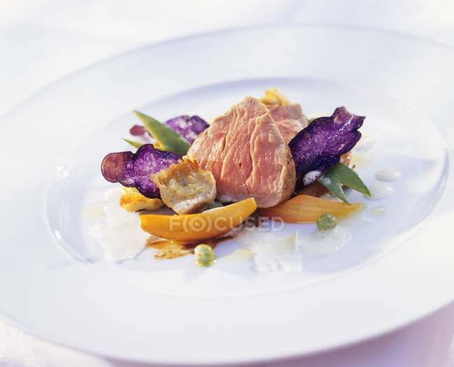 Veal fillet with potato crisps — Stock Photo