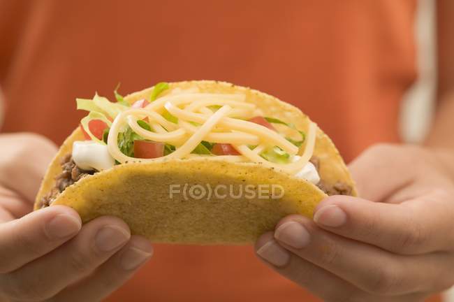 Hands  holding  taco — Stock Photo