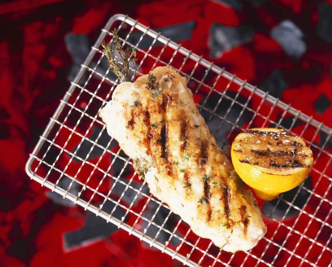 Grilled Monk-fish with herbs and lemon — Stock Photo
