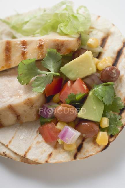 Chicken fajita with chicken breast and  salsa  over white surface — Stock Photo