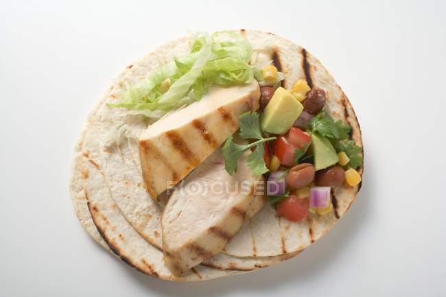 Fajita with chicken breast and salsa  on white background — Stock Photo