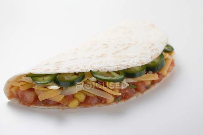 Tortilla filled with salsa — Stock Photo