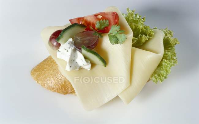 Slices of cheese on baguette — Stock Photo