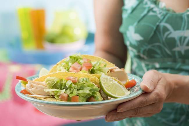 Woman holding plate — Stock Photo