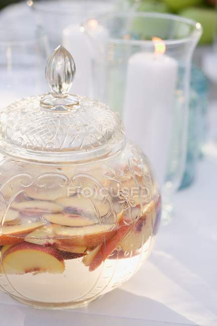 Peach punch served in vintage crystal bowl — Stock Photo