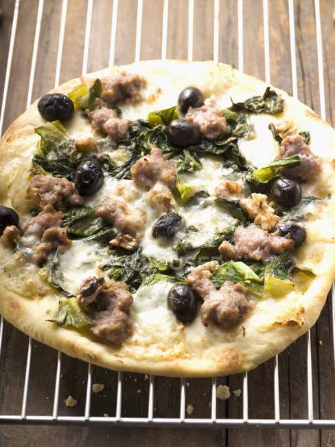 Delicious pizza with mince and spinach — Stock Photo