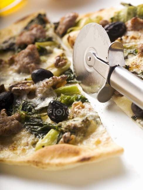 Delicious pizza with mince and spinach — Stock Photo