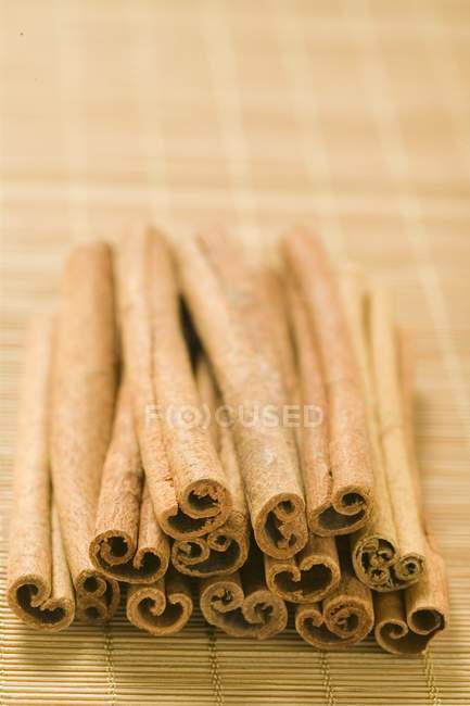 Cinnamon sticks on the table napkin — Stock Photo