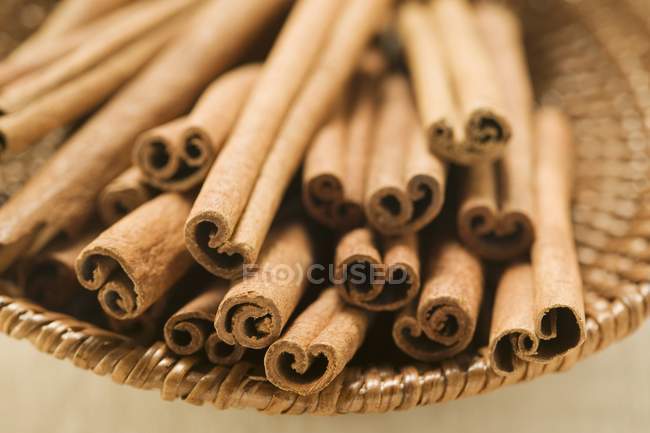 Cinnamon sticks in basket — Stock Photo