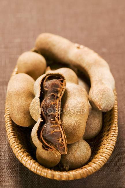 Several tamarinds in basket — Stock Photo