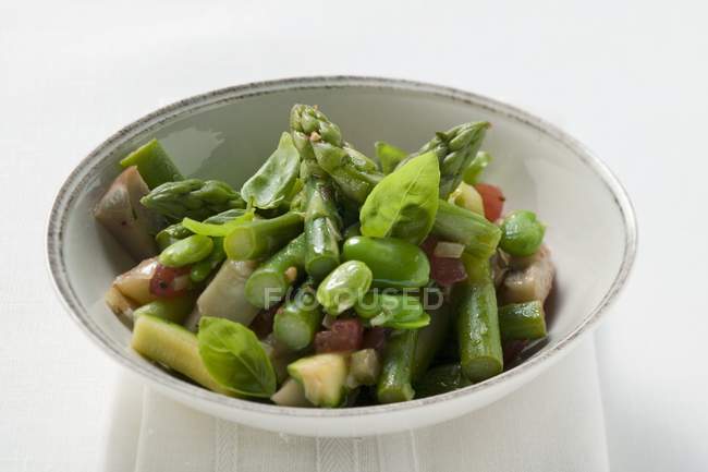 Closeup view of green asparagus salad with beans and basil — Stock Photo