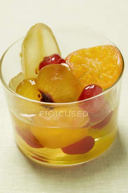 Closeup view of candied fruit with mustard in glass — Stock Photo