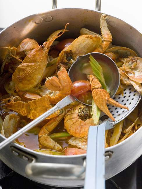Crayfish stew in stew pan — Stock Photo