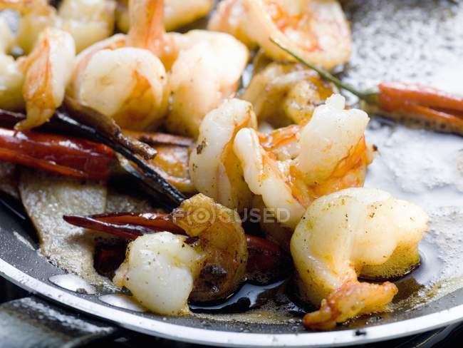 Fried shrimps with chili peppers — Stock Photo