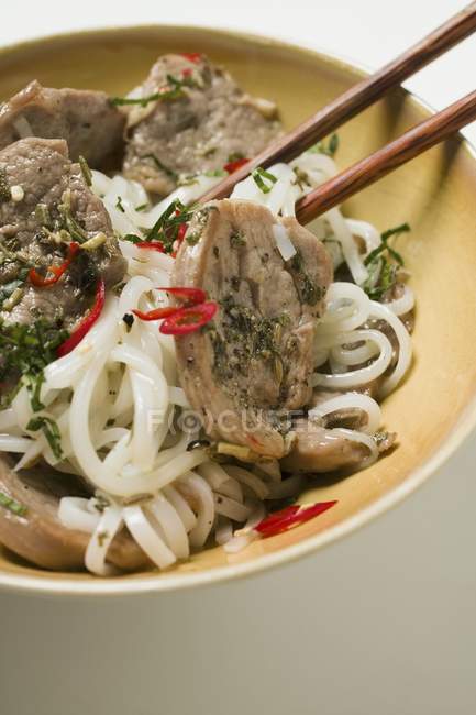 Rice noodles with pork fillets — Stock Photo