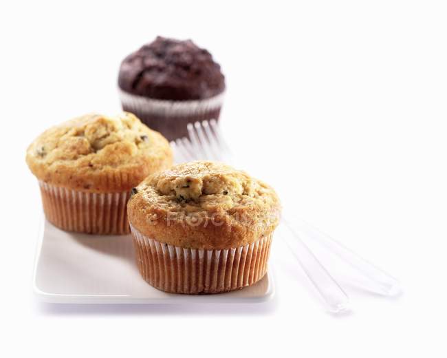 Tre muffin sul piatto — Foto stock