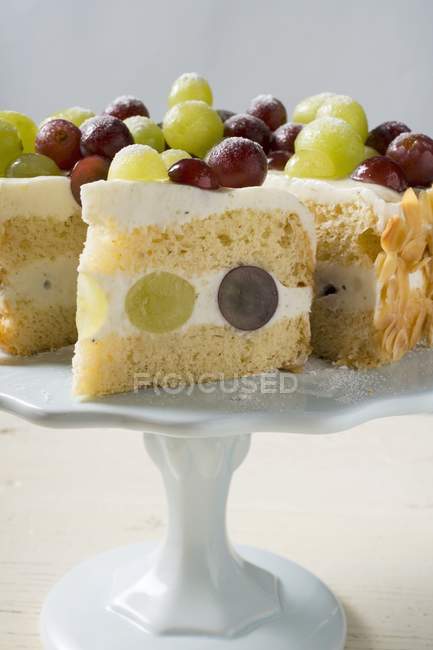 Grape cake on cake stand — Stock Photo