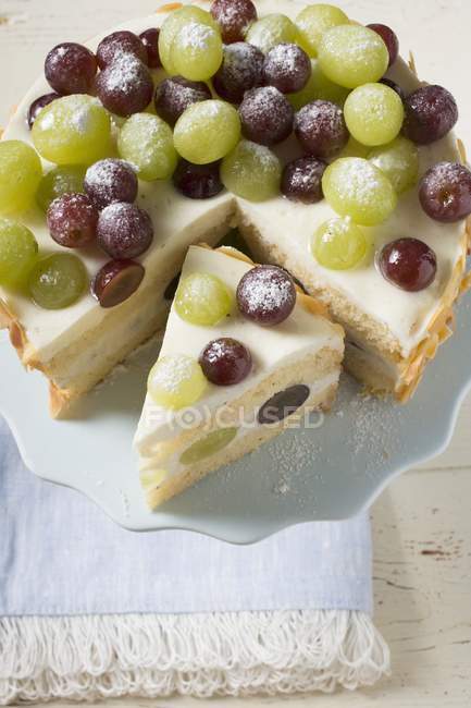 Grape cake on cake stand — Stock Photo