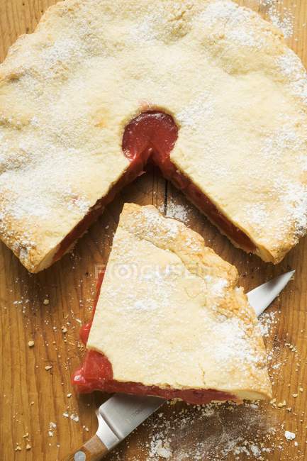 Cherry pie slice on knife — Stock Photo