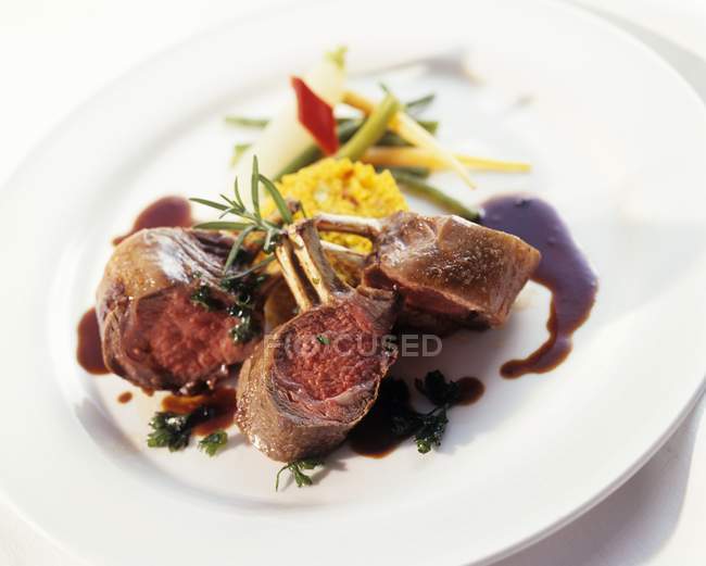 Pieces of roasted lamb with saffron couscous — Stock Photo