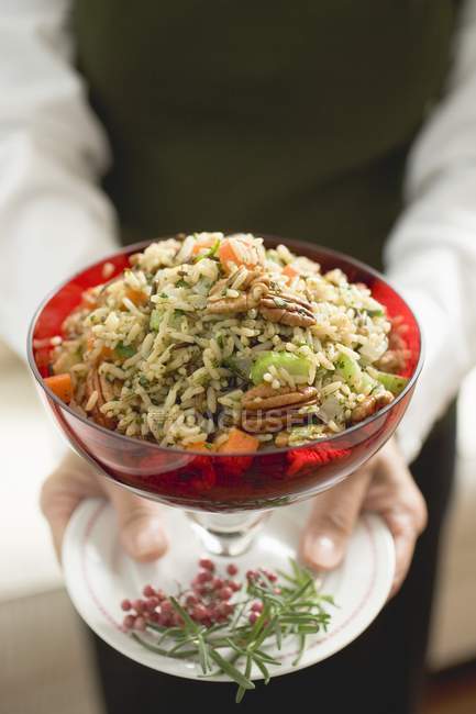 Bowl of vegetable rice with pecans — Stock Photo