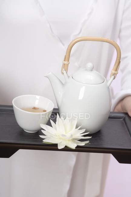 Woman holding teapot — Stock Photo