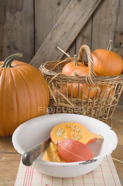 Rustic pumpkins in basket — Stock Photo