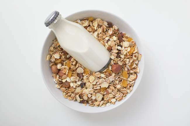 Cereal and bottle of milk — Stock Photo