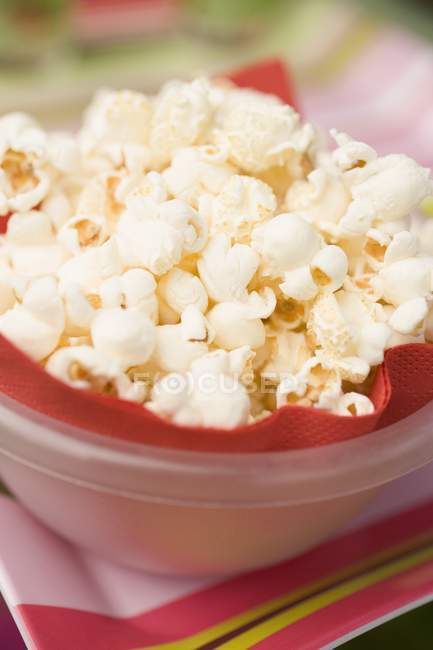 Popcorn in plastic bowl — Stock Photo