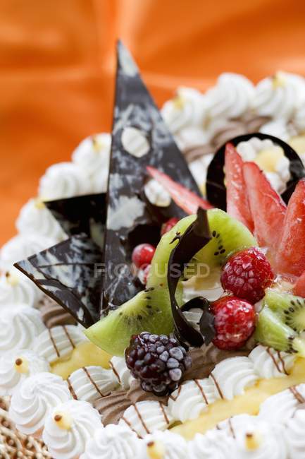 Cake decoration of chocolate and fruit — Stock Photo