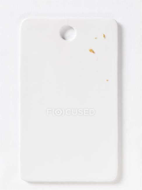 Closeup top view of white porcelain board — Stock Photo