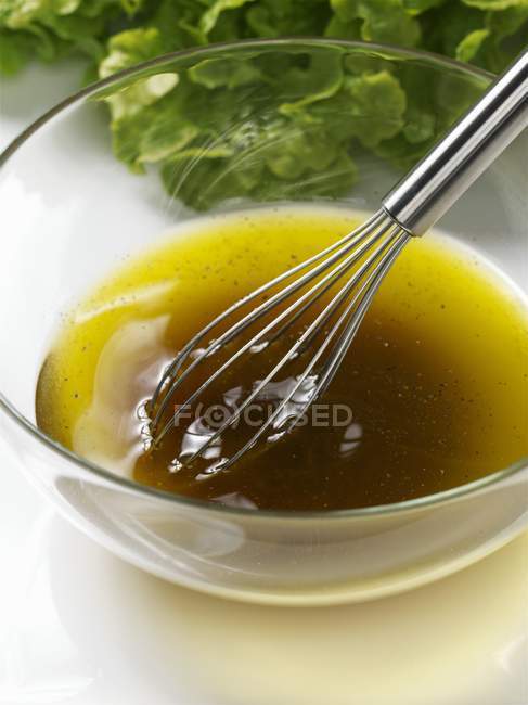 Glass dish with whisk — Stock Photo