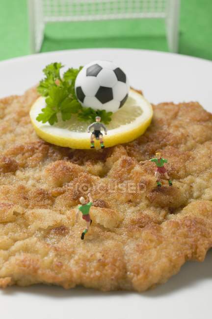 Veal escalope with figures — Stock Photo