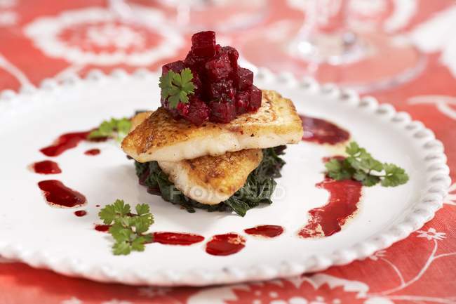 Beets on Roasted Cod and Spinach — Stock Photo