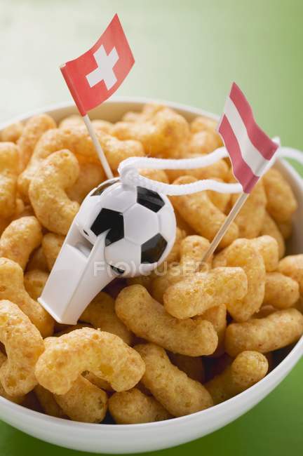 Peanut puffs with flags — Stock Photo