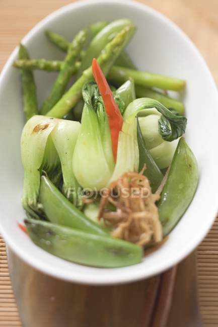 Steamed vegetables with chilli on white plate — Stock Photo
