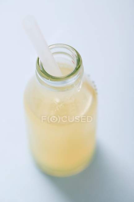 Lemon juice in bottle — Stock Photo