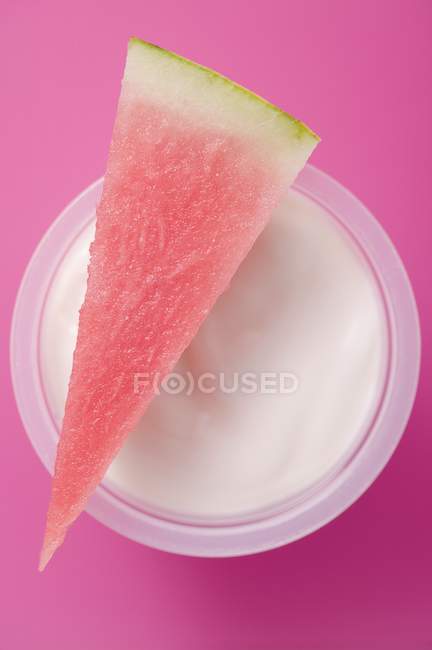 Yoghurt with piece of watermelon — Stock Photo