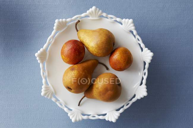 Pears and blood oranges — Stock Photo
