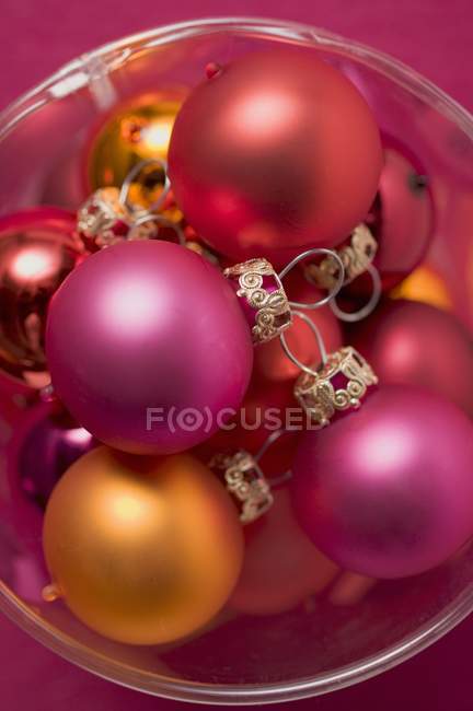 Christmas tree baubles in plastic container — Stock Photo