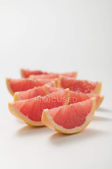 Wedges of pink grapefruit — Stock Photo